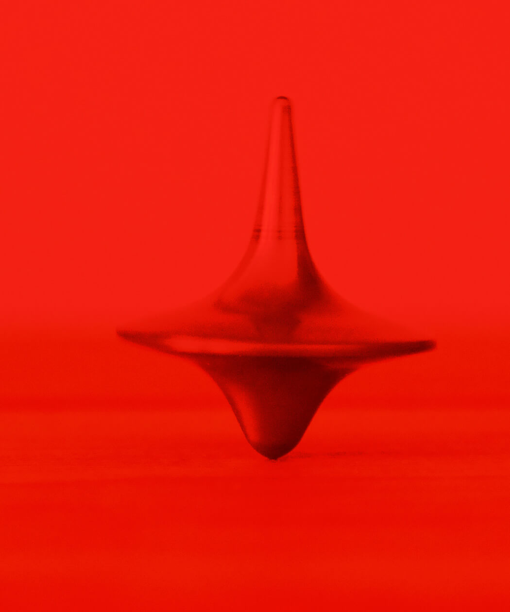 Spinning top in red filter